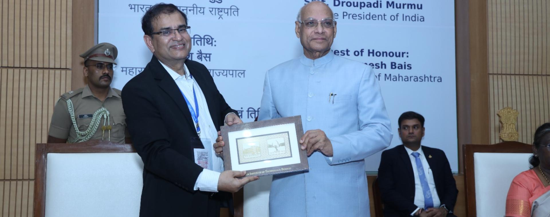 Governor of Maharashtra Ramesh Bais receiving memento