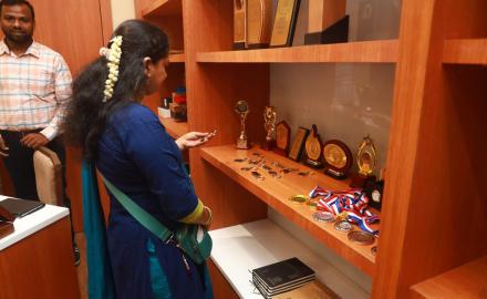 An employee checking out collection of IIT Bombay merchandise at the launch of Institute’s New Souvenir Shop